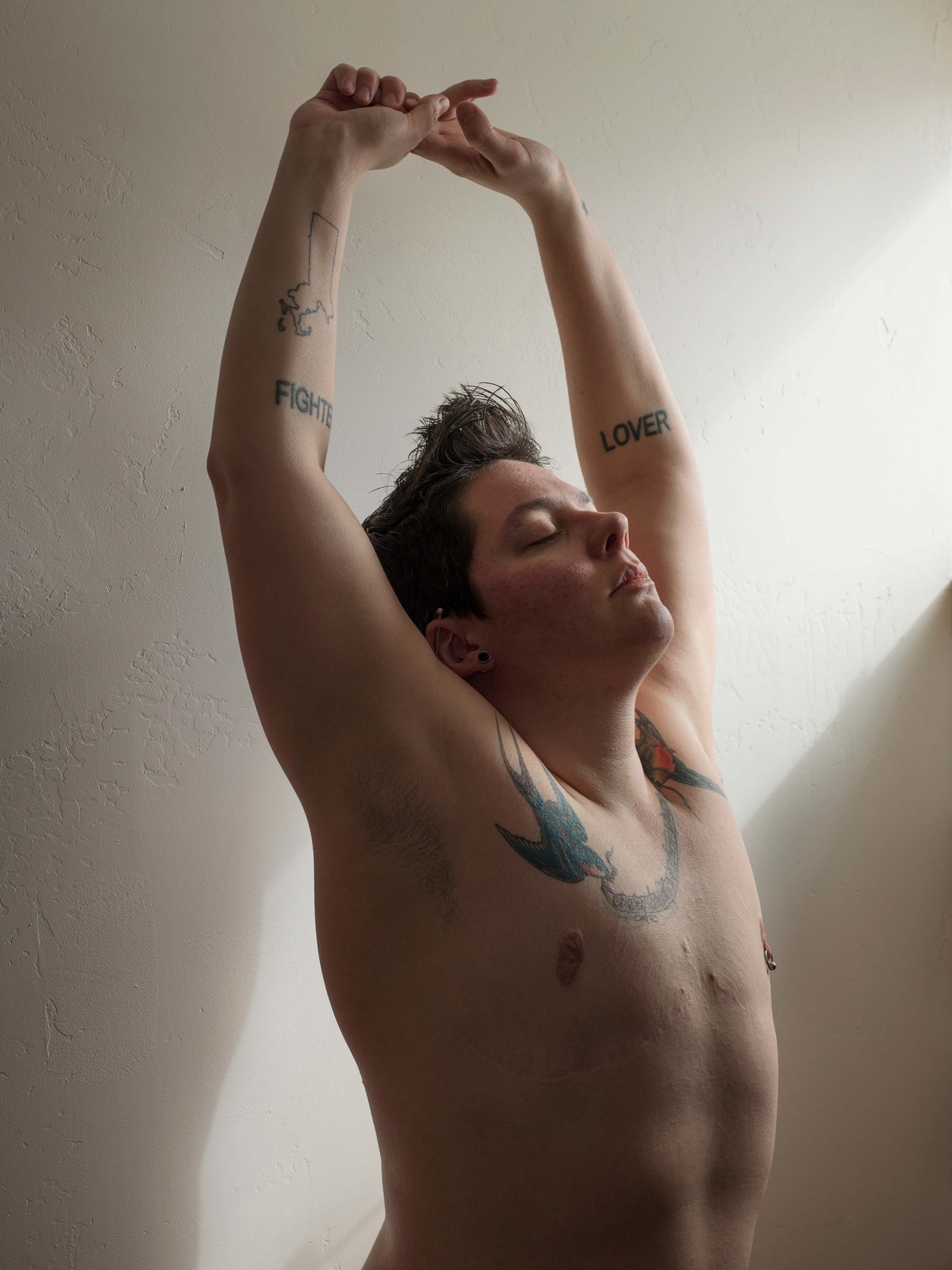 Jess T. Dugan, Self-portrait (reaching), 2014. Courtesy of the Catherine Edelman Gallery, Chicago.