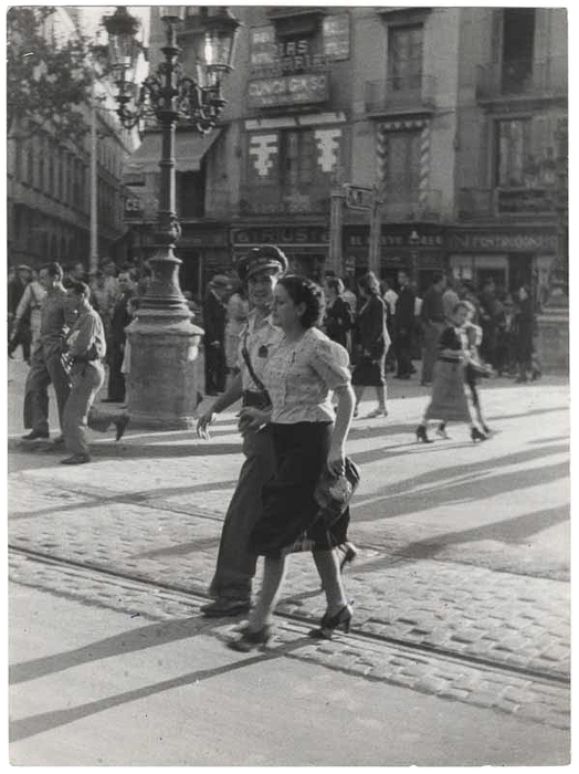 [Couple walking down the street in Barcelona, Spain]