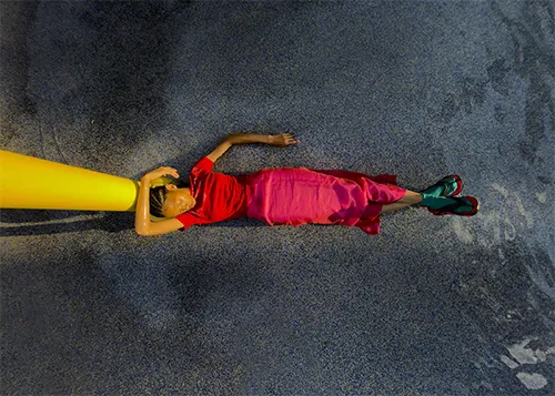 A woman laying on the floor.