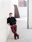 A person leaning on the wall.