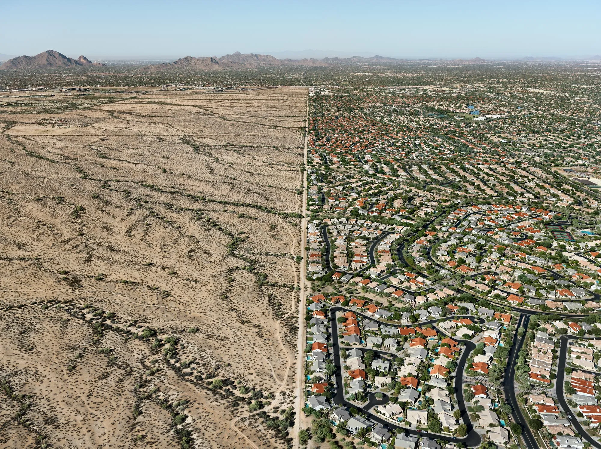 Aerial view of suburbs and native american reservation next to each other