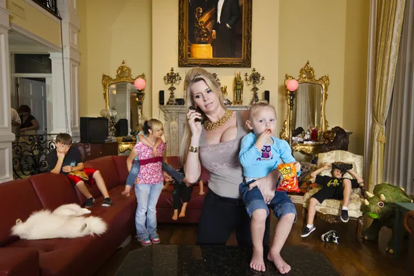 A lady holding a toddler.